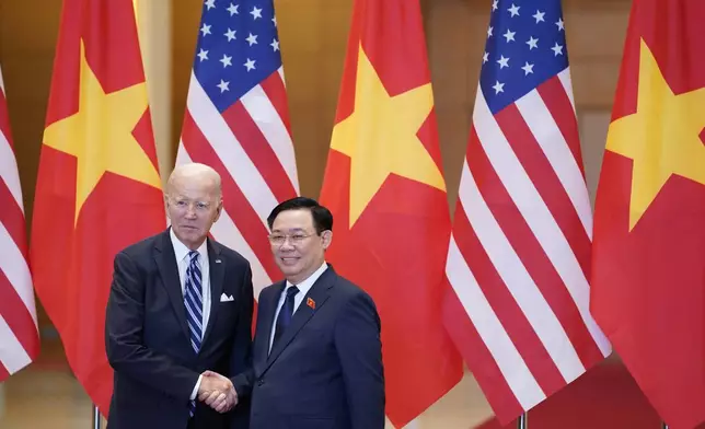 FILE - U.S. President Joe Biden, left, meets with Chairman of the National Assembly of Vietnam, Vuong Dinh Hue in Hanoi, Vietnam, Monday, Sept. 11, 2023. Vietnamese state media outlet VN Express reports that the head of Vietnam’s Parliament, Vuong Dinh Hue, has resigned. He is the latest member of senior government to leave office amid an ongoing anti-corruption campaign. (AP Photo/Evan Vucci, File)