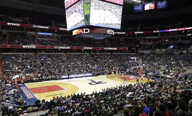 FILE - The New Orleans Pelicans and the Washington Wizards play in an NBA basketball game in Washington, Dec. 19, 2017. The NBA’s Washington Wizards and NHL’s Washington Capitals are staying in the District of Columbia. Owner Ted Leonsis and Mayor Muriel Bowser announced the development at a news conference at Capital One Arena on Wednesday, March 27, 2024. (AP Photo/Mark Tenally, File)