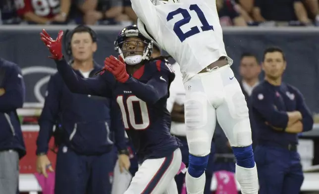 FILE - Indianapolis Colts cornerback Vontae Davis (21) defends on a pass intended for Houston Texans wide receiver DeAndre Hopkins (10) during the second half of an NFL football game Sunday, Oct., 16, 2016, in Houston. Former Miami Dolphins and Indianapolis Colts cornerback Vontae Davis was found dead in his South Florida home on Monday, April 1, 2024, but police say no foul play is suspected.(AP Photo/George Bridges, File)
