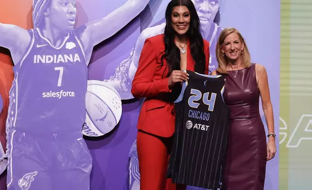 South Carolina's Kamilla Cardoso, left, poses for a photo with WNBA commissioner Cathy Engelbert after being selected third overall by the Chicago Sky during the first round of the WNBA basketball draft, Monday, April 15, 2024, in New York. (AP Photo/Adam Hunger)
