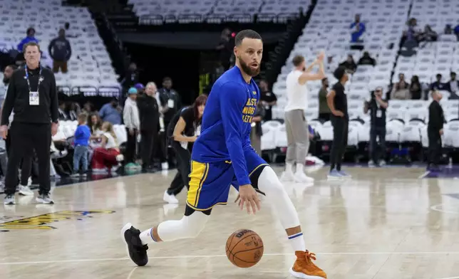 Golden State Warriors guard Stephen Curry warms up for the team's NBA basketball play-in tournament game against the Sacramento Kings, Tuesday, April 16, 2024, in Sacramento, Calif. (AP Photo/Godofredo A. Vásquez)