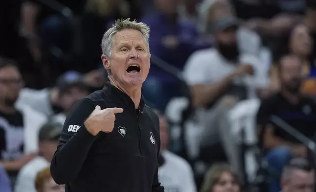 Golden State Warriors head coach Steve Kerr gestures during the first half of an NBA basketball play-in tournament game against the Sacramento Kings, Tuesday, April 16, 2024, in Sacramento, Calif. (AP Photo/Godofredo A. Vásquez)