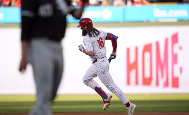 Philadelphia Phillies' Brandon Marsh rounds the bases after hitting a two-run home run against Chicago White Sox pitcher Michael Soroka during the second inning of a baseball game, Saturday, April 20, 2024, in Philadelphia. (AP Photo/Matt Slocum)