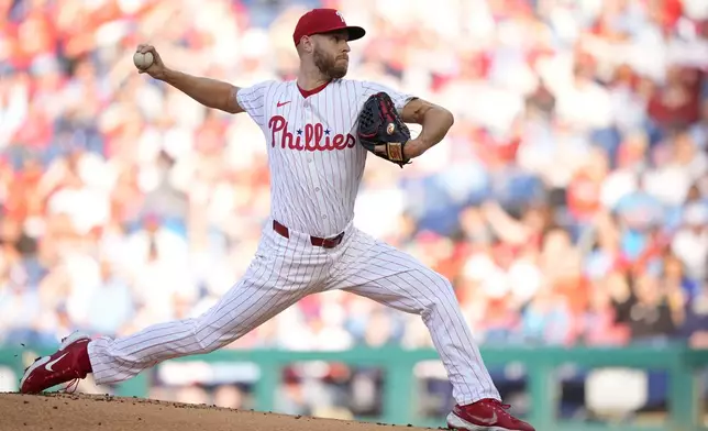 Philadelphia Phillies' Zack Wheeler pitches during the first inning of a baseball game against the Chicago White Sox, Saturday, April 20, 2024, in Philadelphia. (AP Photo/Matt Slocum)