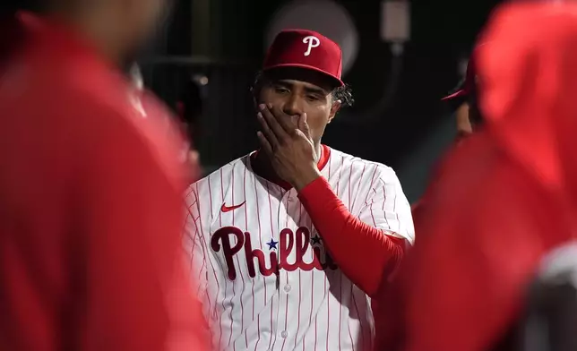 Philadelphia Phillies pitcher Ricardo Pinto wipes his face after being pulled during the ninth inning of a baseball game against the Chicago White Sox, Saturday, April 20, 2024, in Philadelphia. (AP Photo/Matt Slocum)