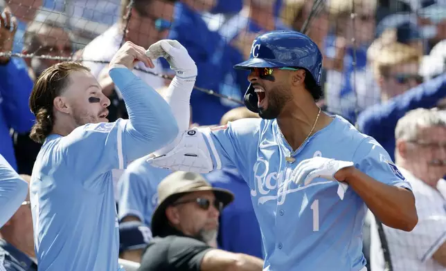 Kansas City Royals' MJ Melendez (1) celebrates with Bobby Witt Jr., left, after hitting a two-run home run during the seventh inning of a baseball game against the Chicago White Sox in Kansas City, Mo., Sunday, April 7, 2024. (AP Photo/Colin E. Braley)