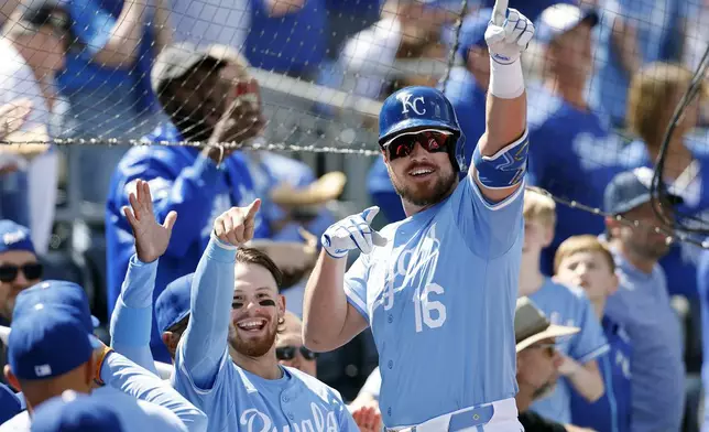 Kansas City Royals' Hunter Renfroe (16) celebrates after his two-run home run with Bobby Witt Jr., left, during the fifth inning of a baseball game against the Chicago White Sox in Kansas City, Mo., Sunday, April 7, 2024. (AP Photo/Colin E. Braley)