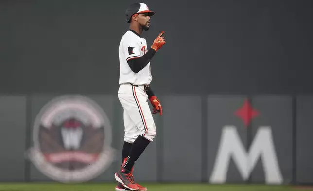 Minnesota Twins' Byron Buxton points after hitting a single during the sixth inning of the team's baseball game against the Chicago White Sox, Wednesday, April 24, 2024, in Minneapolis. (AP Photo/Abbie Parr)