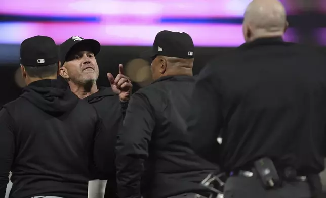 Chicago White Sox manager Pedro Grifol, second from left, points toward home plate umpire Mike Estabrook, right, after being ejected after the top of the eighth inning of a baseball game against the Minnesota Twins, Monday, April 22, 2024, in Minneapolis. (AP Photo/Abbie Parr)