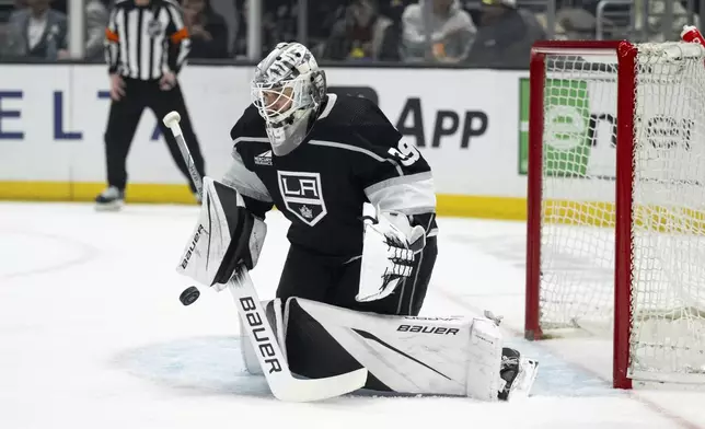 Los Angeles Kings goaltender Cam Talbot (39) blocks a shot during the first period of an NHL hockey game against the Minnesota Wild, Monday, April 15, 2024, in Los Angeles. (AP Photo/Kyusung Gong)