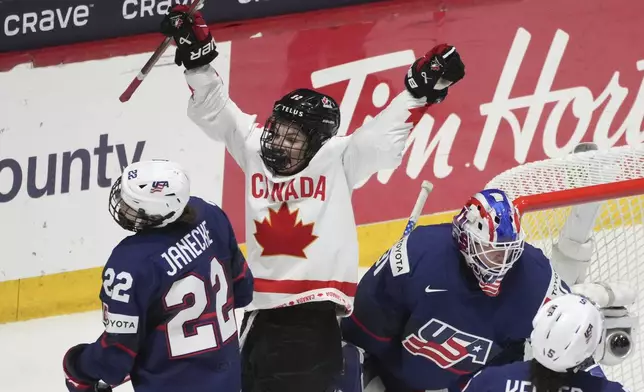 Canada's Danielle Serdachny (92) celebrates the goal by teammate Marie-Philip Poulin, not shown, over United States goaltender Aerin Frankel (31) during the second period in the final at the IIHF Women's World Hockey Championships in Utica, N.Y., Sunday, April 14, 2024. (Christinne Muschi/The Canadian Press via AP)