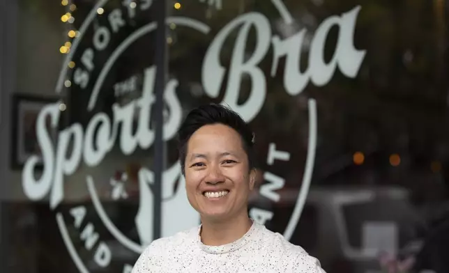 The Sports Bra founder and CEO Jenny Nguyen poses for a photo at the sports bar on Thursday, April 25, 2024, in Portland, Ore. (AP Photo/Jenny Kane)