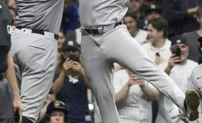 New York Yankees' Aaron Judge celebrates his two-run home run with Juan Soto during the sixth inning of a baseball game against the Milwaukee Brewers Saturday, April 27, 2024, in Milwaukee. (AP Photo/Morry Gash)