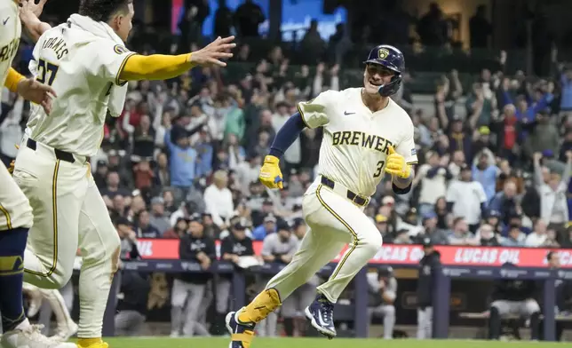 Milwaukee Brewers' Joey Ortiz reacts after hitting a walk off RBI single during the 11th inning of a baseball game against the New York Yankees Friday, April 26, 2024, in Milwaukee. (AP Photo/Morry Gash)