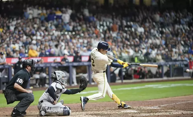 Milwaukee Brewers' Joey Ortiz hits a walk off RBI single during the 11th inning of a baseball game against the New York Yankees Friday, April 26, 2024, in Milwaukee. (AP Photo/Morry Gash)