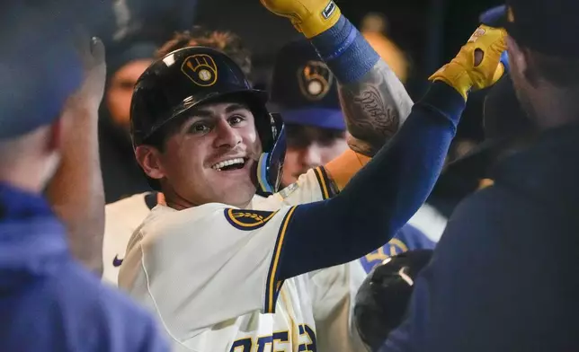Milwaukee Brewers' Joey Ortiz is congratulated after hitting a two-run home run during the second inning of a baseball game against the New York Yankees Friday, April 26, 2024, in Milwaukee. (AP Photo/Morry Gash)