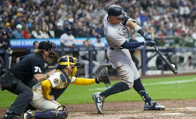 New York Yankees' Aaron Judge hits an RBI single during the sixth inning of a baseball game against the Milwaukee Brewers Sunday, April 28, 2024, in Milwaukee. (AP Photo/Morry Gash)