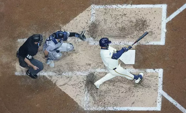 Milwaukee Brewers' Blake Perkins hits a two-run home run during the third inning of a baseball game against the New York Yankees Friday, April 26, 2024, in Milwaukee. (AP Photo/Morry Gash)