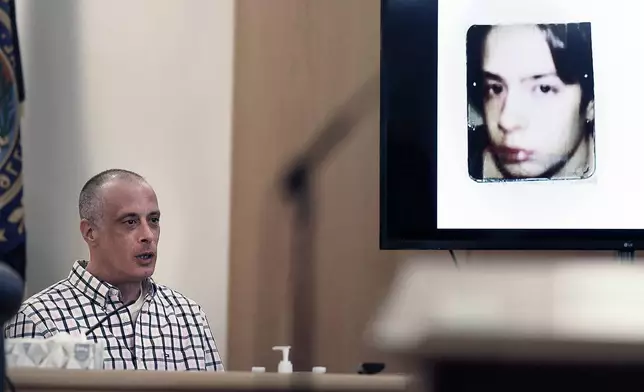 Youth Development Center. plaintiff David Meehan testifies as his intake photo, when he was 14 is displayed during his civil trial at Rockingham County Superior Court in Brentwood, N.H. on Wednesday, April 17, 2024. (David Lane/Union Leader via AP, Pool)