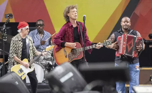 Keith Richards, left, Steve Jordan, Mick Jagger and Dwayne Dopsie perform with the Rolling Stones during the New Orleans Jazz &amp; Heritage Festival on Thursday, May 2nd, 2024, at the Fair Grounds Race Course in New Orleans. (Photo by Amy Harris/Invision/AP)