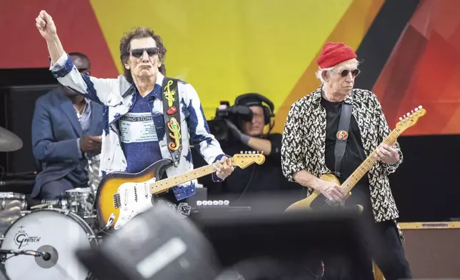 Ron Wood, left, and Keith Richards, of the Rolling Stones, perform during the New Orleans Jazz &amp; Heritage Festival on Thursday, May 2nd, 2024, at the Fair Grounds Race Course in New Orleans. (Photo by Amy Harris/Invision/AP)
