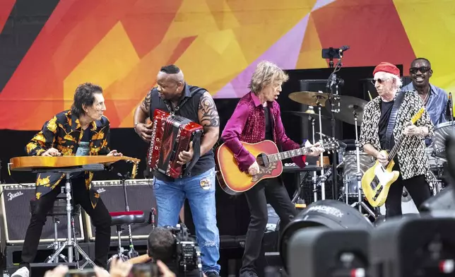 Ron Wood, left, Dwayne Dopsie, Mick Jagger, Keith Richards and Steve Jordan perform with the Rolling Stones during the New Orleans Jazz &amp; Heritage Festival on Thursday, May 2nd, 2024, at the Fair Grounds Race Course in New Orleans. (Photo by Amy Harris/Invision/AP)