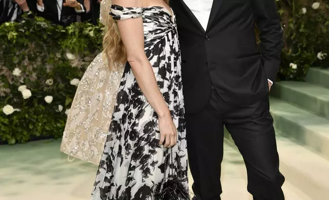Alexi Ashe, left, and Seth Meyers attend The Metropolitan Museum of Art's Costume Institute benefit gala celebrating the opening of the "Sleeping Beauties: Reawakening Fashion" exhibition on Monday, May 6, 2024, in New York. (Photo by Evan Agostini/Invision/AP)