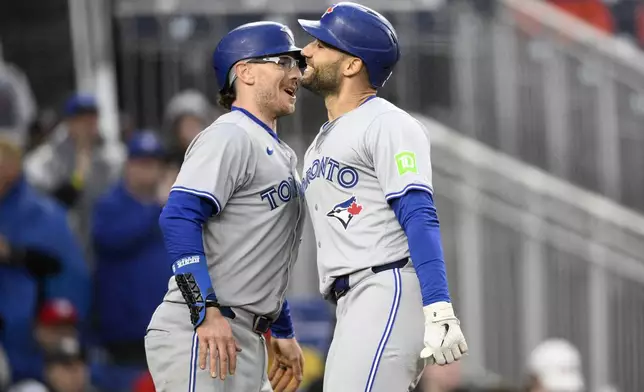 ADDS AMOUNT OF RUNS - Toronto Blue Jays' Kevin Kiermaier, right, celebrates his two-run home run with Danny Jansen during the eighth inning of a baseball game against the Washington Nationals, Saturday, May 4, 2024, in Washington. (AP Photo/Nick Wass)