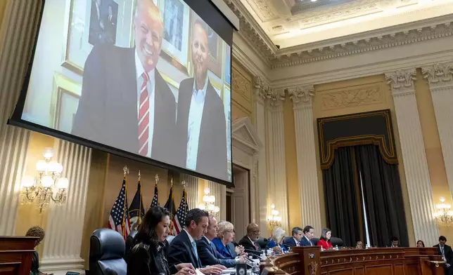 FILE - An image of former President Donald Trump and Brad Parscale, former campaign manager for President Donald Trump, is displayed during a House select committee hearing investigating the Jan. 6 attack on the U.S. Capitol, on Capitol Hill in Washington, Thursday, Oct. 13, 2022. In a text to a former campaign colleague, Parscale wrote he felt “guilty for helping” Trump win after the Jan. 6 riots. (AP Photo/Andrew Harnik, Pool, File)
