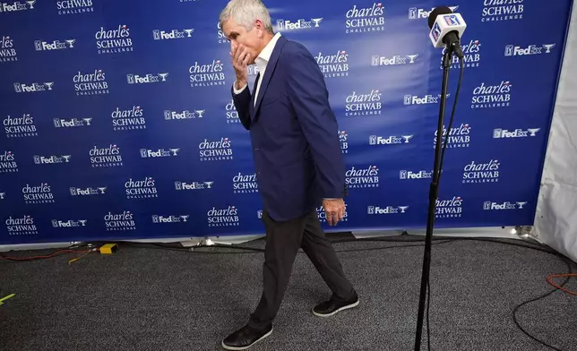 PGA Tour Commissioner Jay Monahan walks away from the microphone after talking about the death of PGA player Grayson Murray during the Charles Schwab Challenge golf tournament at Colonial Country Club in Fort Worth, Texas, Saturday, May 25, 2024. (AP Photo/LM Otero)