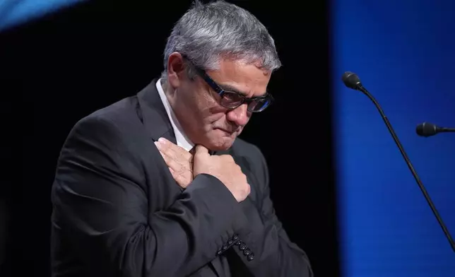 Mohammad Rasoulof accepts the special prize award for the film 'The Seed of the Sacred Fig' during the awards ceremony of the 77th international film festival, Cannes, southern France, Saturday, May 25, 2024 (Photo by Andreea Alexandru/Invision/AP)
