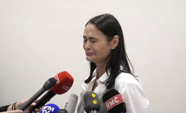 British actor Charlotte Lewis reacts after the verdict against filmmaker Roman Polanski Tuesday, May 14, 2024 in Paris. Roman Polanski was acquitted of defaming the actor whom he described as a liar after she accused the director of sexual assault. (AP Photo/Thibault Camus)