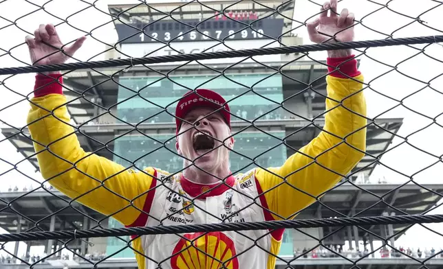 Josef Newgarden celebrates after winning the Indianapolis 500 auto race at Indianapolis Motor Speedway in Indianapolis, Sunday, May 26, 2024. (AP Photo/AJ Mast)