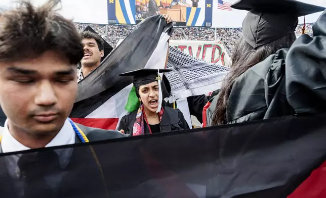 Pro-Palestinian protesters demonstrate during the University of Michigan's Spring 2024 Commencement Ceremony at Michigan Stadium in Ann Arbor, Mich., on Saturday, May 4, 2024. (Jacob Hamilton/Ann Arbor News via AP)