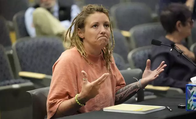 Cara Lamb, ex-wife of shooter Robert Card, testifies, Thursday, May 16, 2024, in Augusta, Maine, during a hearing of the independent commission investigating the law enforcement response to the mass shooting in Lewiston, Maine. (AP Photo/Robert F. Bukaty)