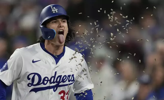 Los Angeles Dodgers' James Outman celebrates after hitting a home run during the second inning of a baseball game against the Miami Marlins in Los Angeles, Monday, May 6, 2024. Gavin Lux also scored. (AP Photo/Ashley Landis)