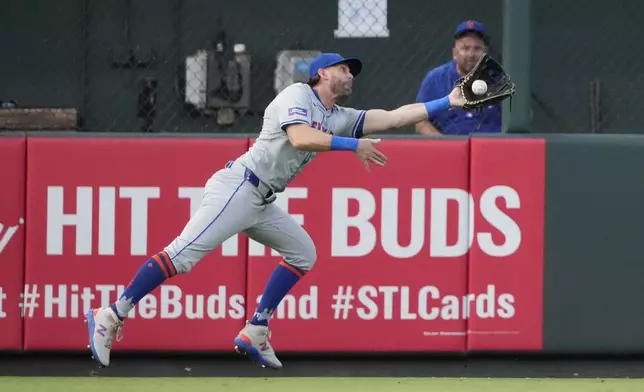 New York Mets left fielder Jeff McNeil dives and catches a fly ball by St. Louis Cardinals' Ivan Herrera during the second inning of a baseball game Monday, May 6, 2024, in St. Louis. (AP Photo/Jeff Roberson)