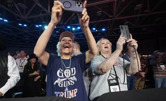 Supporters cheer for former President Donald Trump before he speaks at the National Rifle Association Convention, Saturday, May 18, 2024, in Dallas. (AP Photo/LM Otero)
