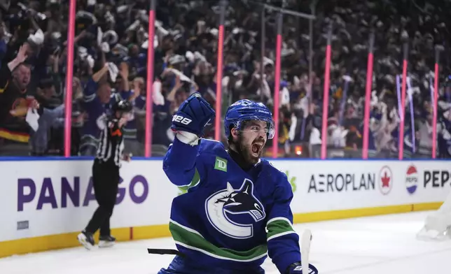 Vancouver Canucks' Conor Garland celebrates his goal against the Edmonton Oilers during the third period of Game 1 of a second-round NHL hockey Stanley Cup playoffs series, Wednesday, May 8, 2024, in Vancouver, British Columbia. (Darryl Dyck/The Canadian Press via AP)