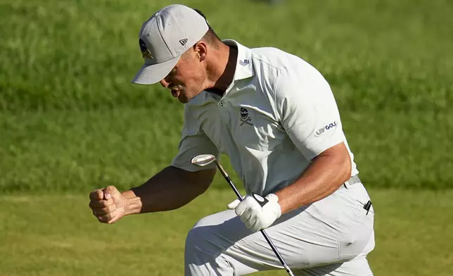 Bryson DeChambeau celebrates after a eagle on the 18th hole during the third round of the PGA Championship golf tournament at the Valhalla Golf Club, Saturday, May 18, 2024, in Louisville, Ky. (AP Photo/Sue Ogrocki)