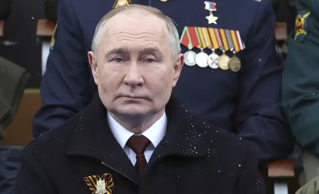 Russian President Vladimir Putin sits during the Victory Day military parade in Moscow, Russia, Thursday, May 9, 2024, marking the 79th anniversary of the end of World War II. (Mikhail Klimentyev, Sputnik, Kremlin Pool Photo via AP)