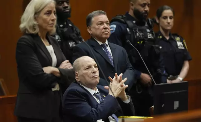 Harvey Weinstein appears in Queens criminal court, with his attorneys, Diana Fabi Samson, left, and John Esposito, Thursday, May 9, 2024, in New York. Harvey Weinstein returned to court in New York City as authorities consider an extradition request from California to serve his sentence for a 2022 rape conviction. The 16-year sentence Weinstein received for raping a woman at a Los Angeles film festival in 2013 had been on ice while he served time in New York. (AP Photo/Julia Nikhinson)