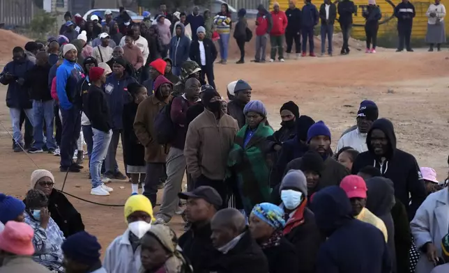 Voters line up to cast their ballot for general elections in Alexandra, near Johannesburg, South Africa, Wednesday, May 29, 2024. South Africans began voting Wednesday in an election seen as their country’s most important in 30 years, and one that could put their young democracy in unknown territory. (AP Photo/Themba Hadebe)