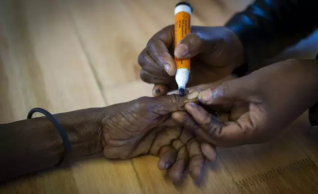 A woman is marked on her hand after casting her ballot on Wednesday May 29, 2024 during general elections in Nkandla, Kwazulu Natal, South Africa. South Africans are voting in an election seen as their country's most important in 30 years, and one that could put them in unknown territory in the short history of their democracy, the three-decade dominance of the African National Congress party being the target of a new generation of discontent in a country of 62 million people — half of whom are estimated to be living in poverty. (AP Photo/Emilio Morenatti)