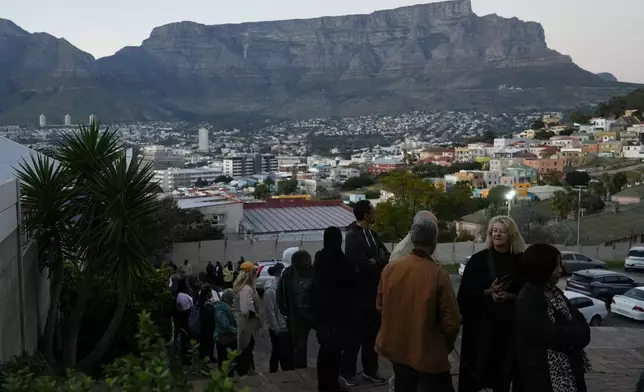 People queue to cast their votes at a polling station during general elections, in Cape Town, South Africa, Wednesday, May 29, 2024. South Africans have begun voting in an election seen as their country's most important in 30 years, and one that could put their young democracy in unknown territory. (AP Photo/Nardus Engelbrecht)