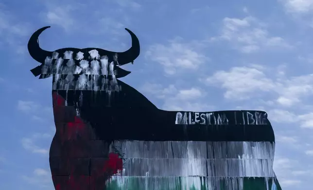 A Spanish fighting bull billboard, is painted with the colours of the Palestinian flag and a writing that reads "free Palestine", on the outskirts of Madrid, Tuesday, May 28, 2024. Spain and Norway have moved to formally recognize a Palestinian state with Ireland to follow suit on Tuesday in a coordinated effort by the three western European nations. While dozens of countries have recognized a Palestinian state, none of the major Western powers has done so. (AP Photo/Bernat Armangue)