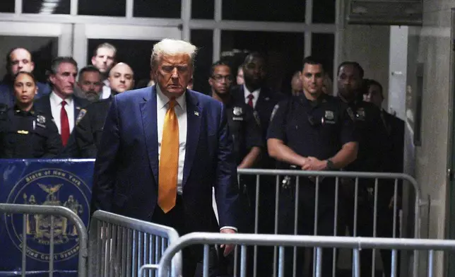 Former President Donald Trump arrives for talking to the media outside Manhattan criminal court in New York, on Tuesday, May 14, 2024. (Curtis Means/Pool Photo via AP)