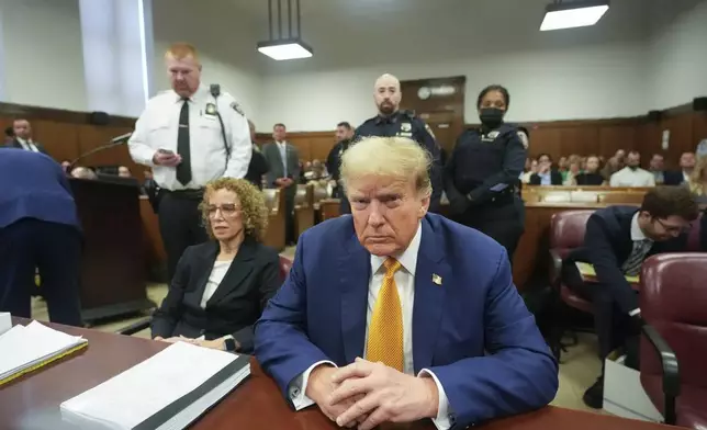 Former President Donald Trump, joined by his attorney Susan Necheles, left, sits at the defense table in Manhattan criminal court, Tuesday, May 7, 2024, in New York. (AP Photo/Mary Altaffer, Pool)