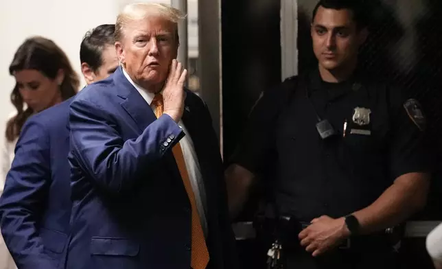 Former President Donald Trump speaks to reporters as he returns to the courtroom after an afternoon break in his trial at Manhattan criminal court, Tuesday, May 7, 2024, in New York. (AP Photo/Mary Altaffer, Pool)