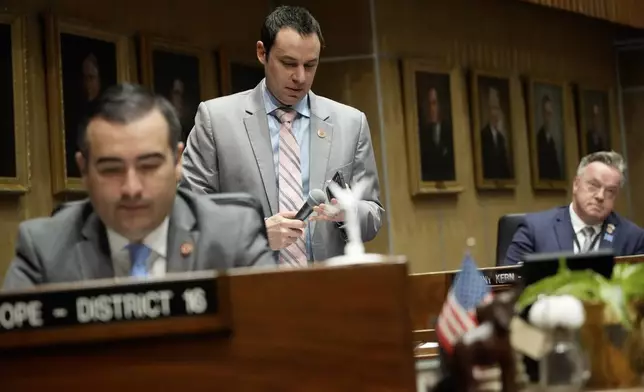 Arizona state senator J. D. Mesnard, R-District 13, plays audio of a heart beat from his cell phone, Wednesday, May 1, 2024, at the Capitol in Phoenix. (AP Photo/Matt York)